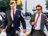 United Development Funding (UDF) CEO Hollis Greenlaw, left, walks to the Fort Worth Federal...