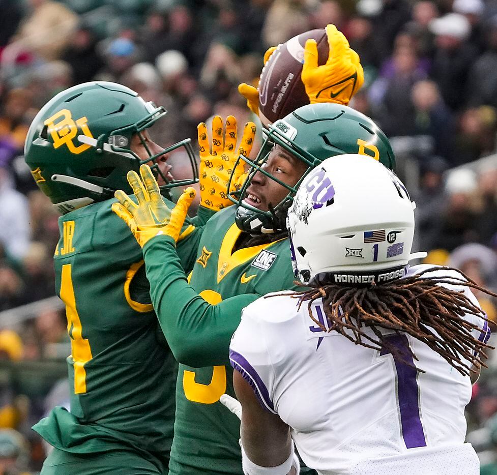 Baylor safety Devin Neal (14) intercepts a pass intended for TCU wide receiver Quentin...