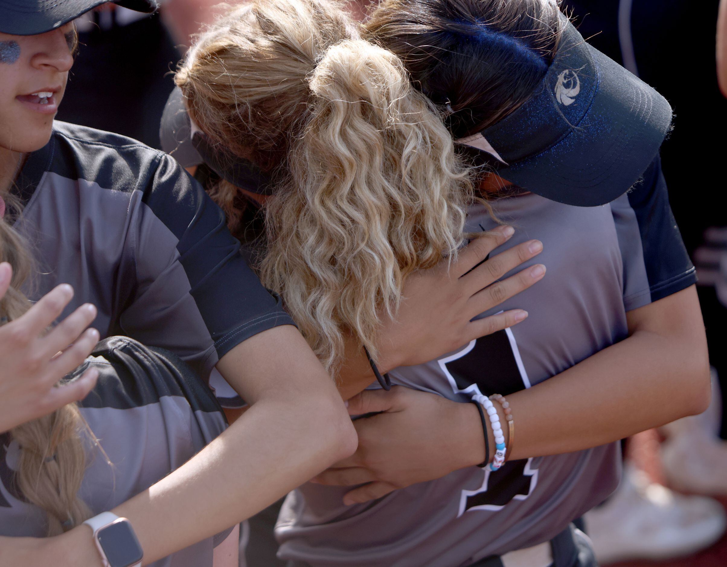 Denton Guyer players share consoling hugs after their 4-2 loss to Pearland. The two teams...