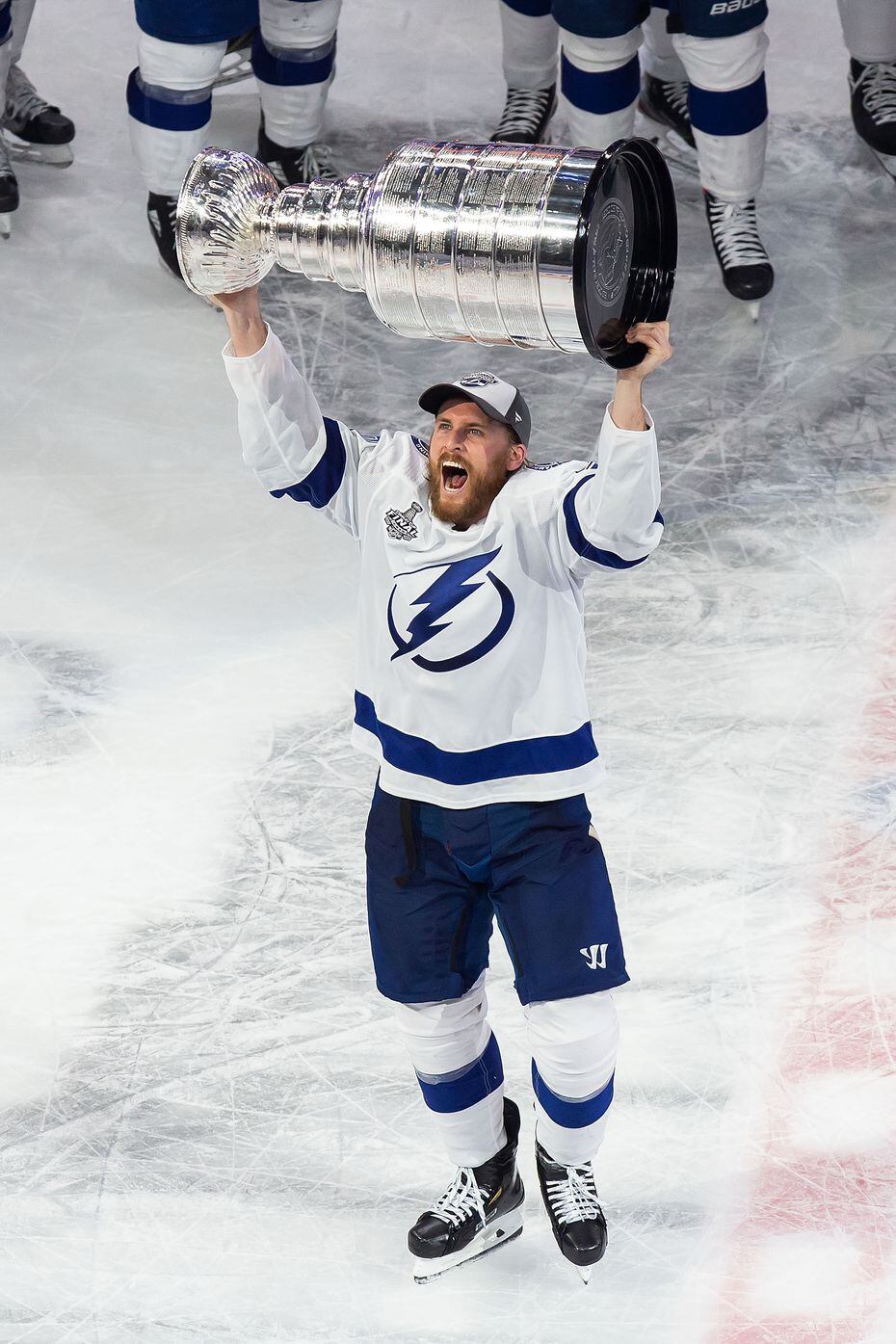 Blake Coleman (20) of the Tampa Bay Lightning hoists the Stanley Cup after defeating the Dallas Stars during Game Six of the Stanley Cup Final at Rogers Place in Edmonton, Alberta, Canada on Monday, September 28, 2020. 