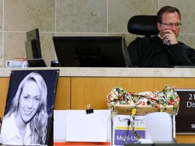 Judge Scott Becker (right) presides during the Jason Lowe murder trial at the Collin County...