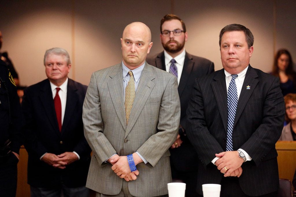 Roy Oliver (center), standing with his attorney Miles Brissette, listens to the judge...