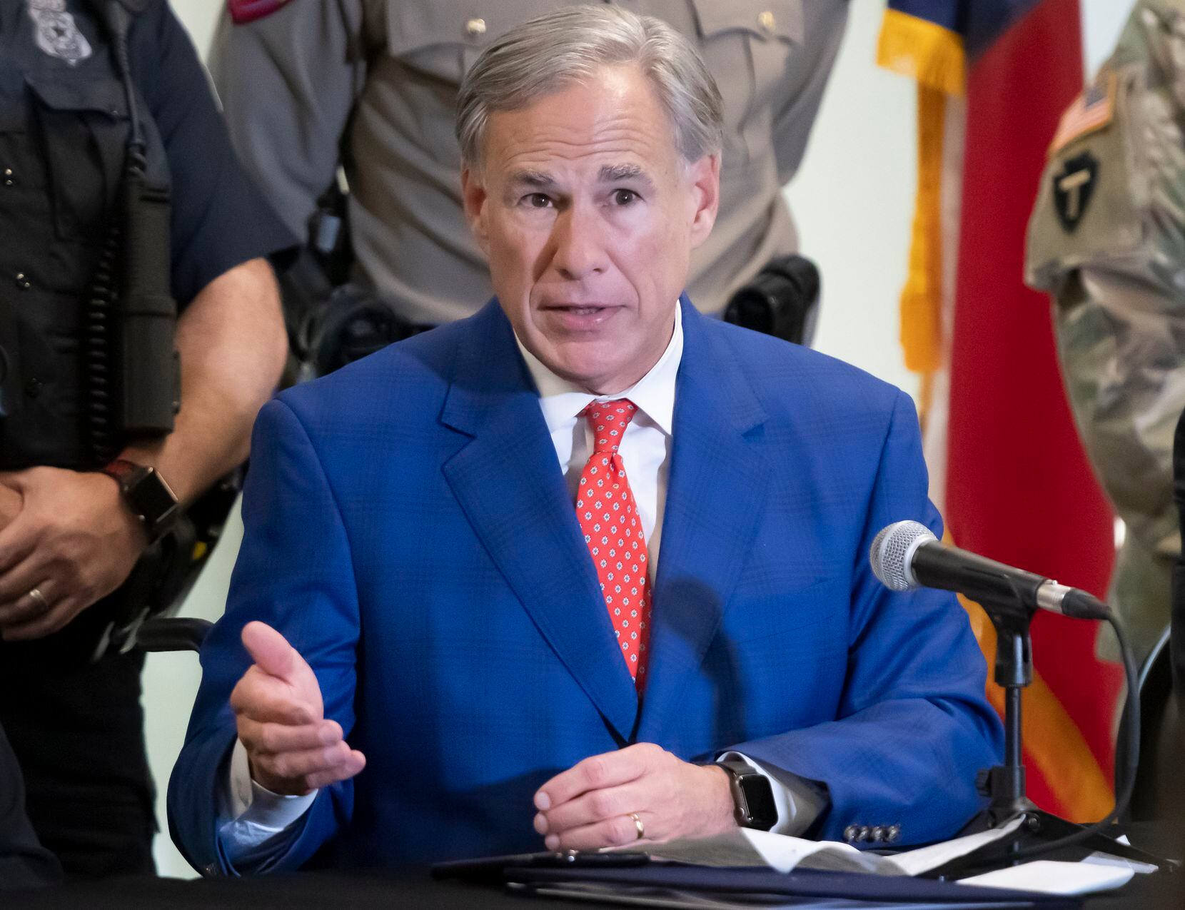 Texas Governor Greg Abbott, answers a question after signing HB9 into law during a press...