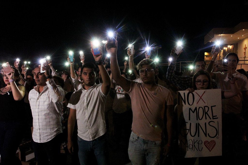 People held their mobile phones with flash on during a vigil in Ciudad Juarez, Chihuahua...