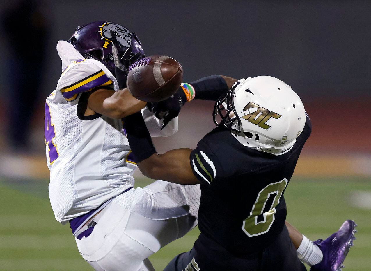 South Oak Cliff defensive back Jayson Thomas (0) breaks up a pass completion by Everman...