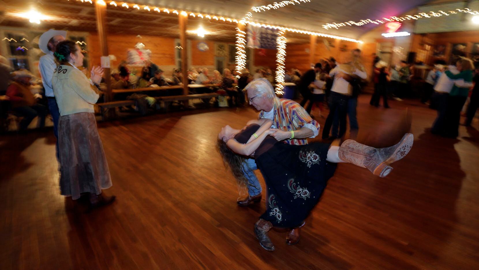 In this Dec. 6, 2014, photo, visitors dance to live music by Al Dressens Super Swing Review...