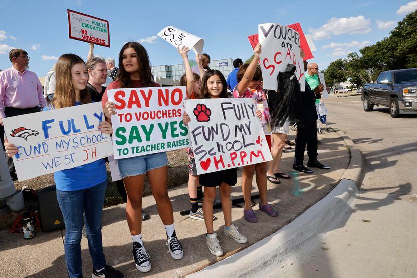 People including Shadia Jaber, 14, left, and Maya Howery, 13,  second from left, both from...