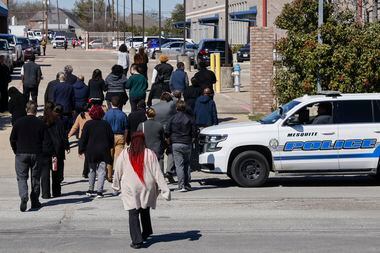 Faculty and staff return to campus after a shooting at Pioneer Technology and Arts Academy,...