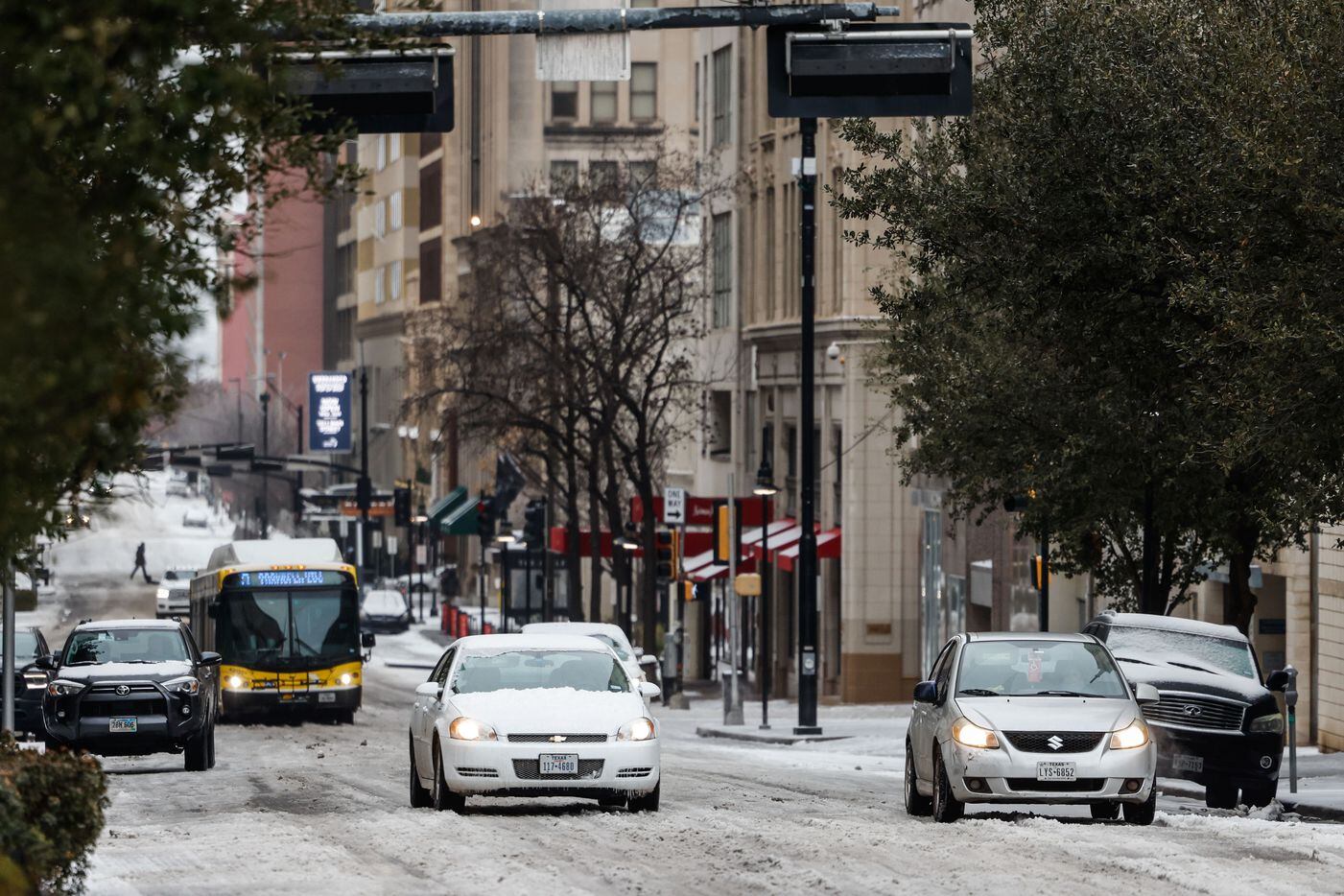 Traffic in downtown Dallas as sleet covered Commerce St on Tuesday, Jan. 31, 2023. Weather...
