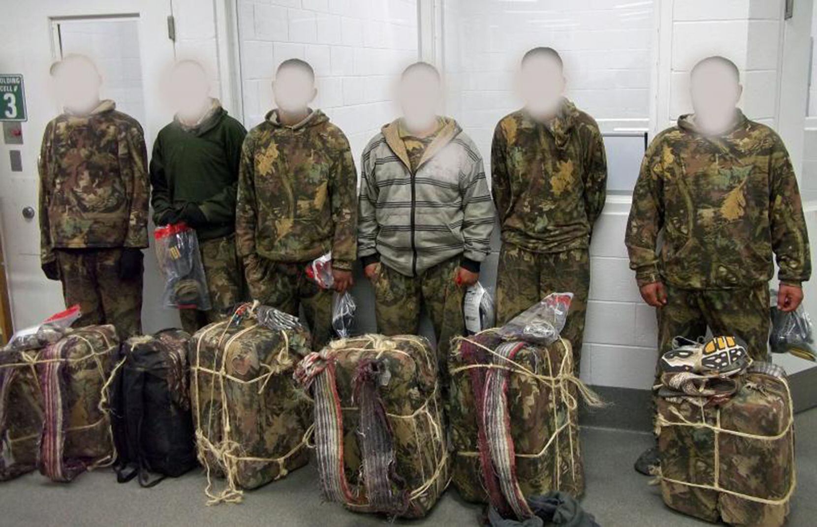 U.S. authorities caught six men on Dec. 21, 2015, as they tried to smuggle 275 pounds of...