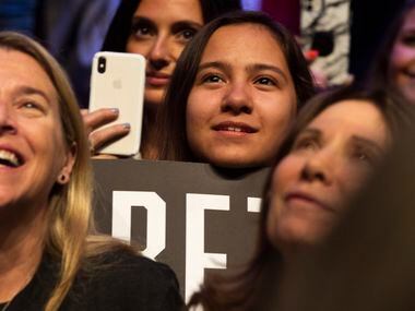 Supporters listen to Democratic presidential candidate and former Texas Rep. Beto O'Rourke...