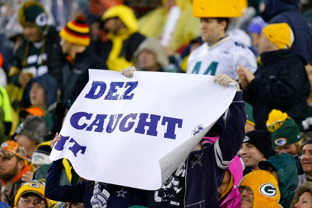 A Dallas Cowboys fan holds up their sign after Dallas Cowboys wide receiver Dez Bryant's...