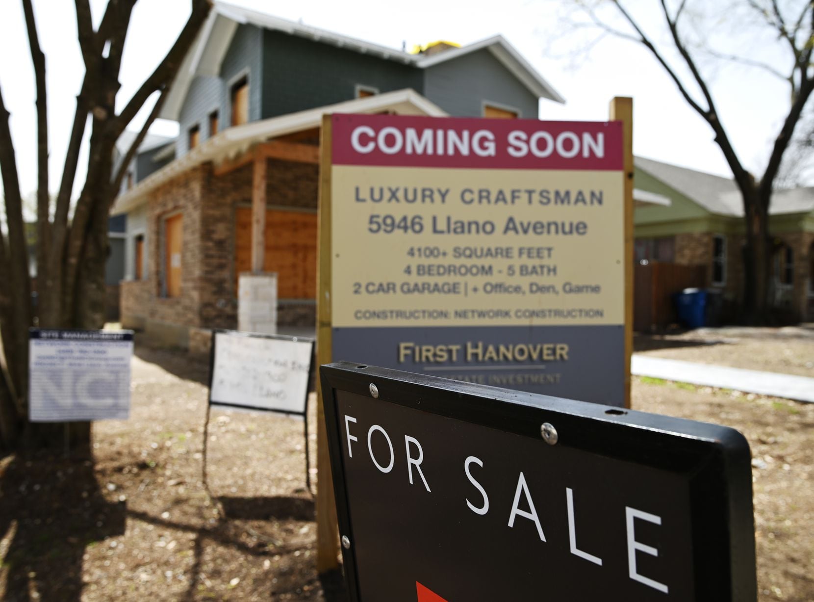 A for sale sign is shown at the construction site of a home on Llano Avenue in Dallas on March 17.