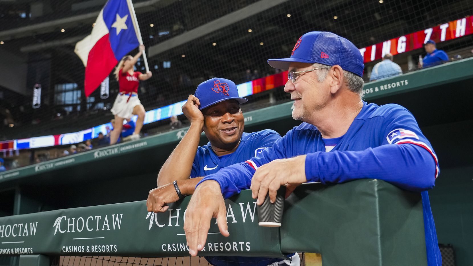 Texas Rangers manager Bruce Bochy (right) laughs with third base coach Tony Beasley before...