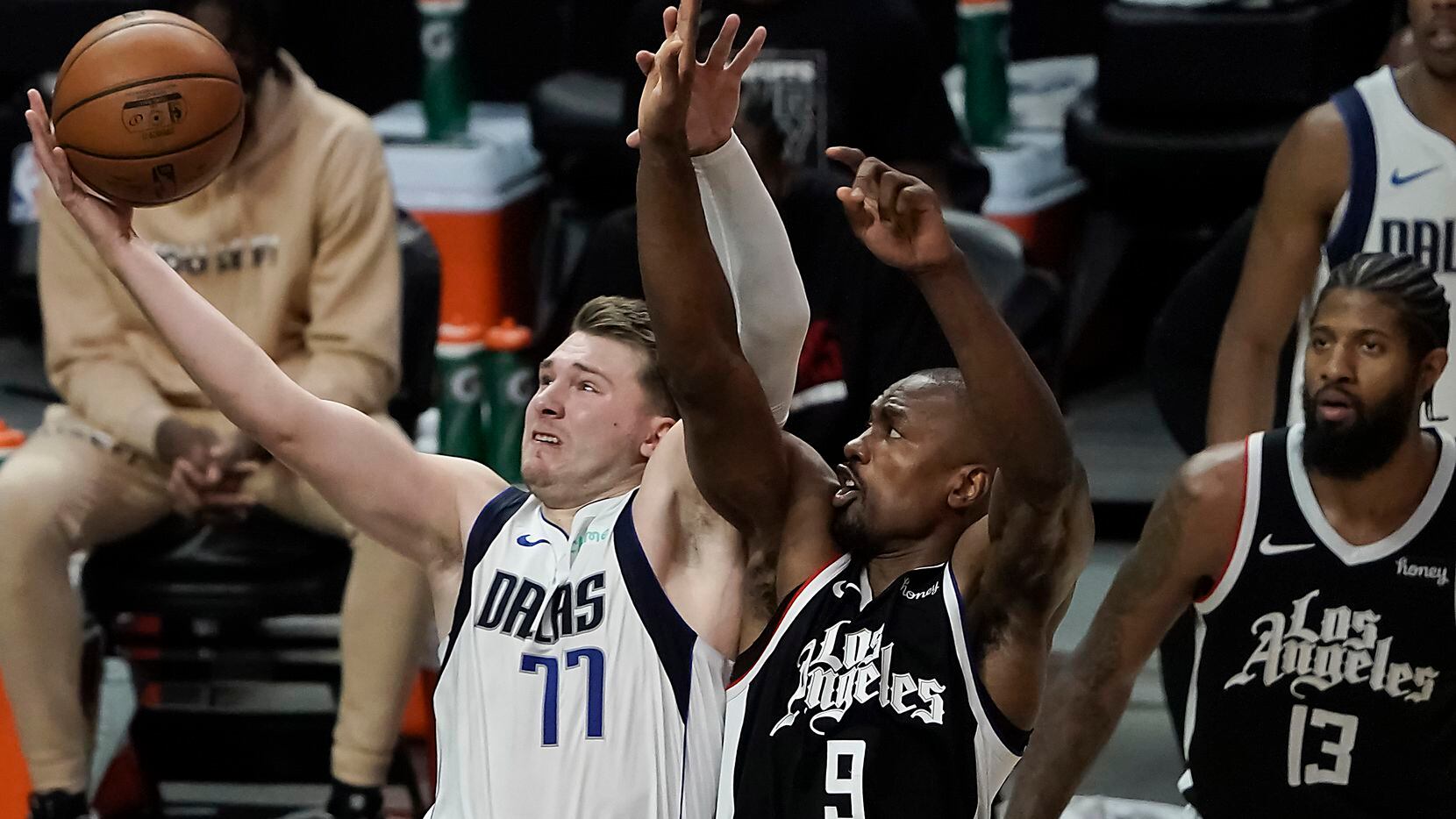 Dallas Mavericks guard Luka Doncic (77) drives to the basket past LA Clippers center Serge Ibaka (9) during the second half of an NBA playoff basketball game at Staples Center on Saturday, May 22, 2021, in Los Angeles. The Mavericks won the game 113-103. 