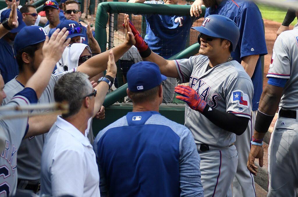 WASHINGTON, DC - JUNE 11:  Shin-Soo Choo #17 of the Texas Rangers celebrates with teammates...