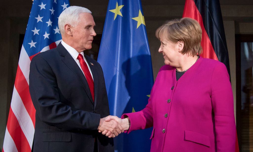 German Chancellor Angela Merkel (R) and US Vice President Mike Pence shake hands at a photo call during the 55th Munich Security Conference in Munich, Germany, on Feb. 16, 2019. 