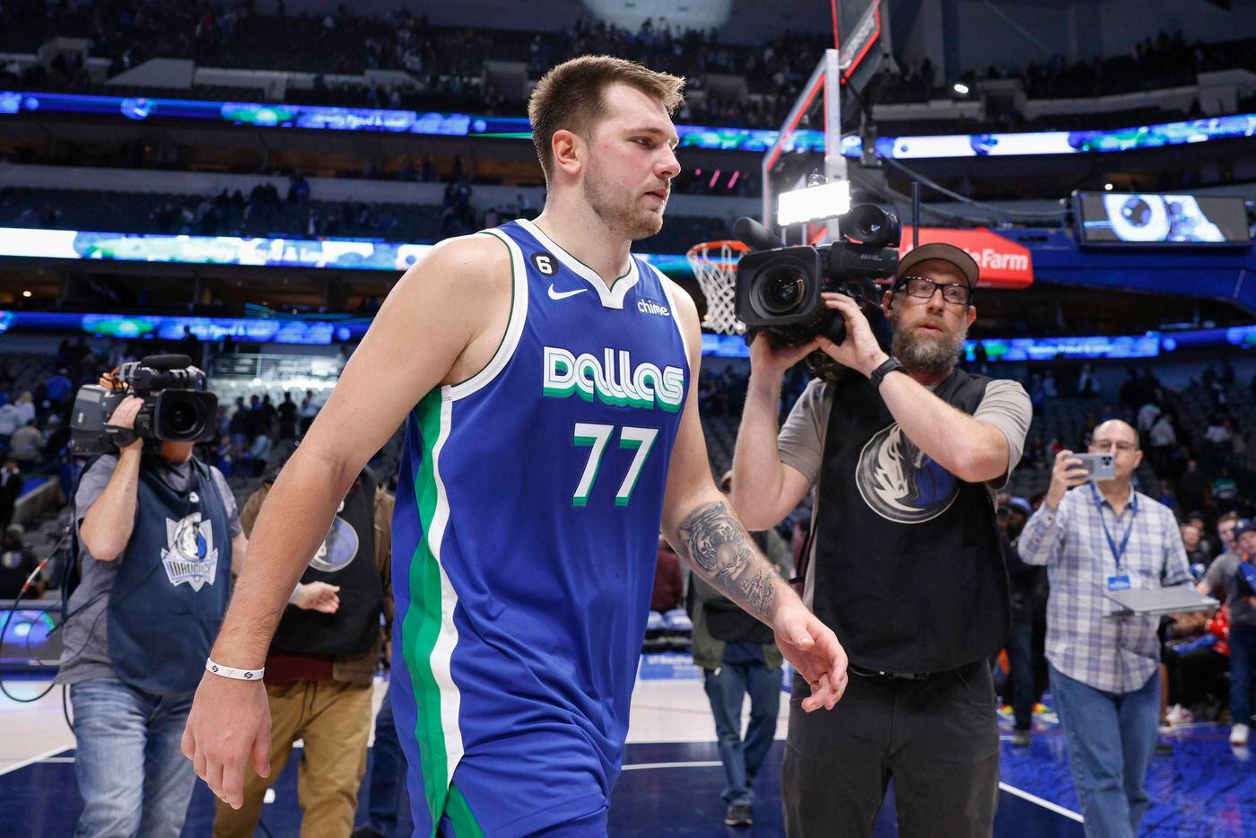 Dallas Mavericks guard Luka Doncic (77) walks off the court after an NBA game against the...