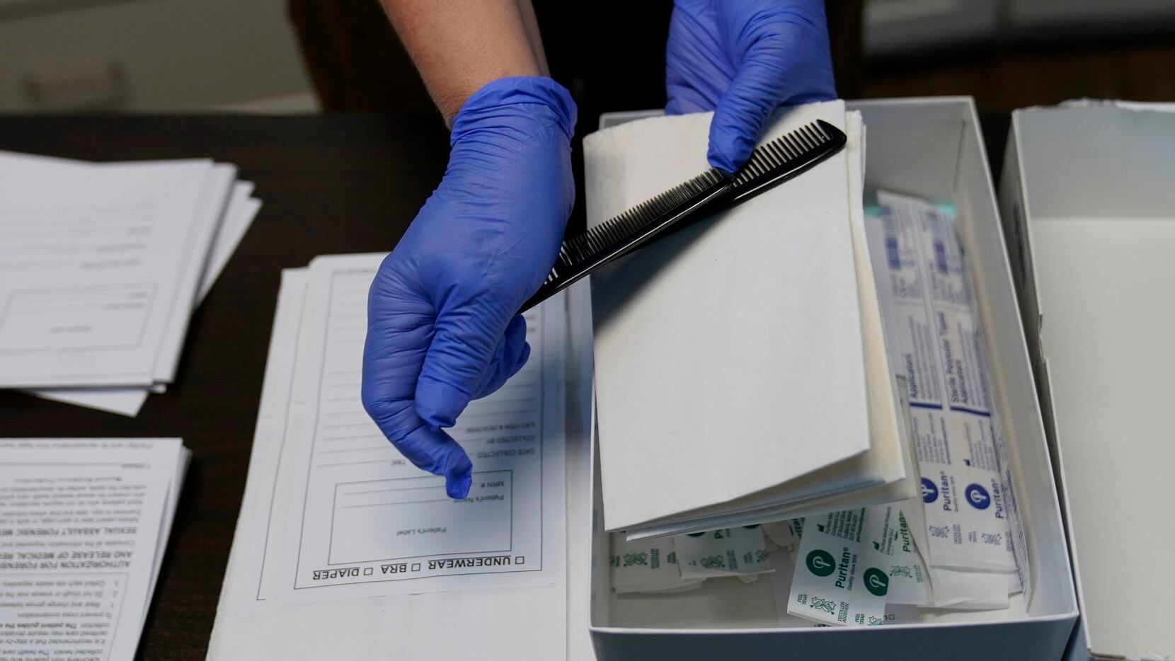 A rape kit is unpacked in an examination room in Austin. More than 14,000 rape crimes have...