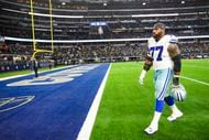 Dallas Cowboys offensive tackle Tyron Smith (77) leaves the field after a loss to the Green...