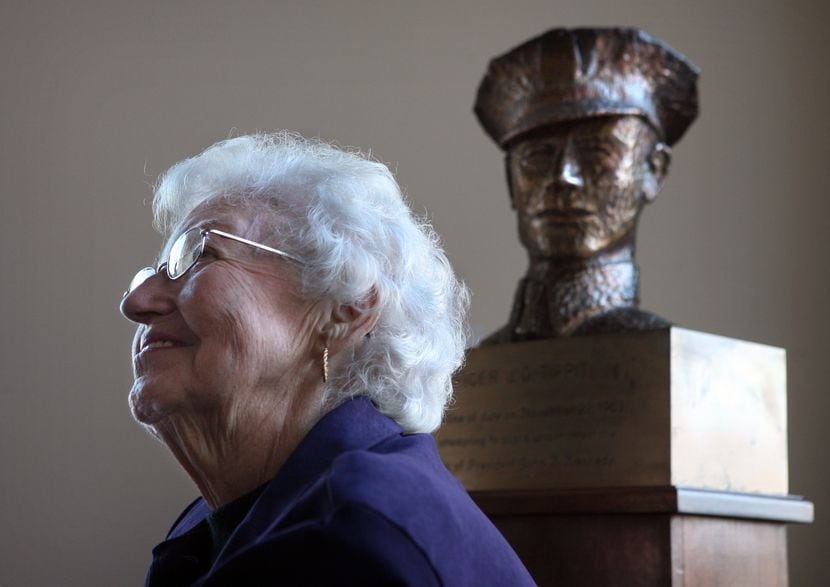 Marie Tippit near a bronze bust of husband J.D. Tippit at Dallas police headquarters in 2008.