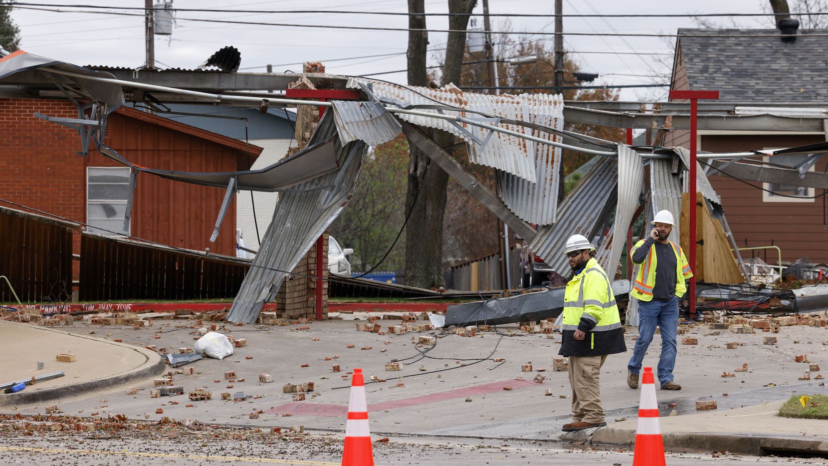 Crews survey damage from a possible tornado in Grapevine.
