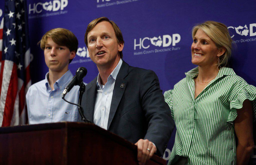 Democratic candidate for governor Andrew White speaks to the media with his family beside...