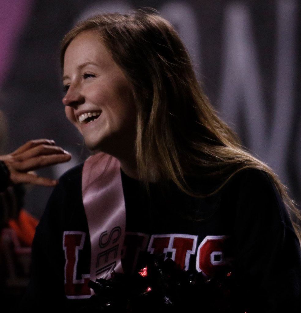 Lake Highlands cheerleader Katie Spaulding beams after the entire student section sang...