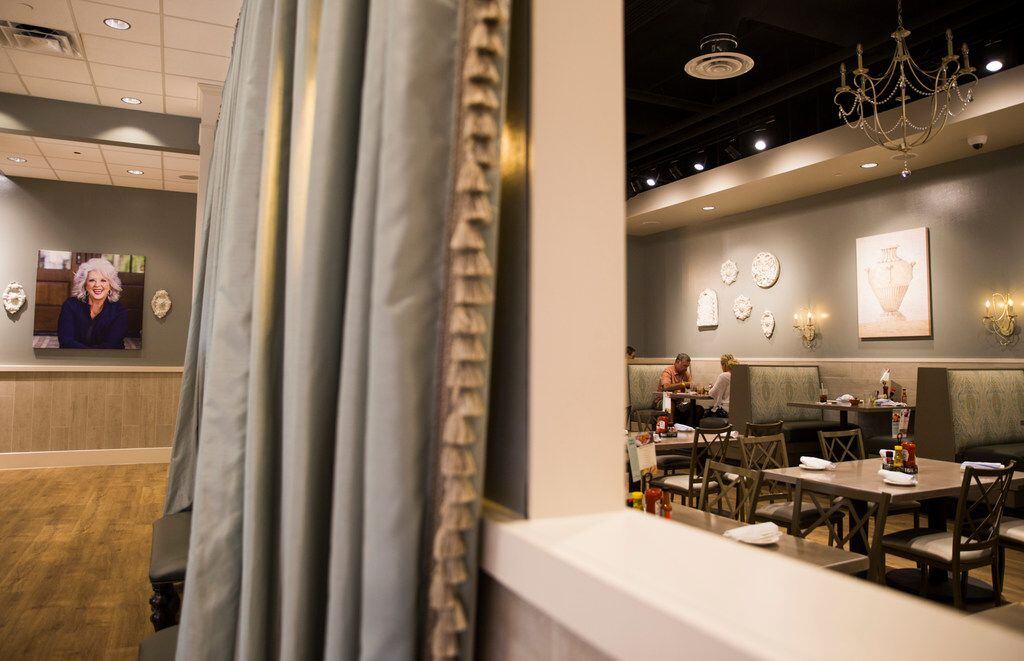 Diners enjoy a meal at a new location of Paula Deen's Family Kitchen restaurant and retail...