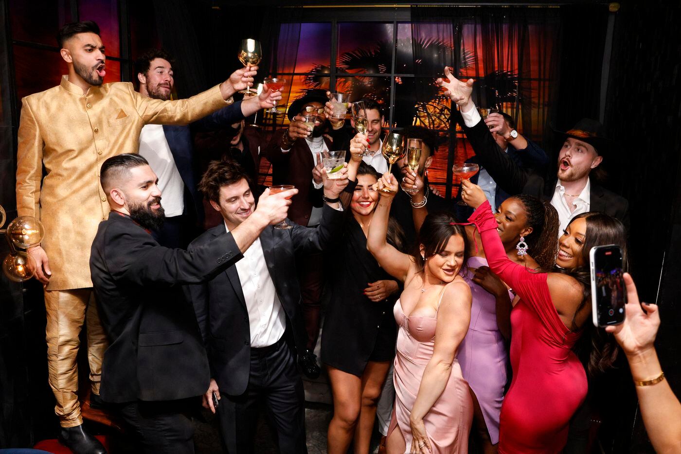 Love is Blind cast members toast during a watch party for the premiere of Love is Blind...