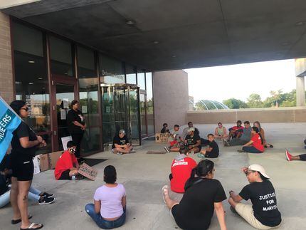 Protesters sat outside the Collin County jail for 15 minutes Tuesday evening.