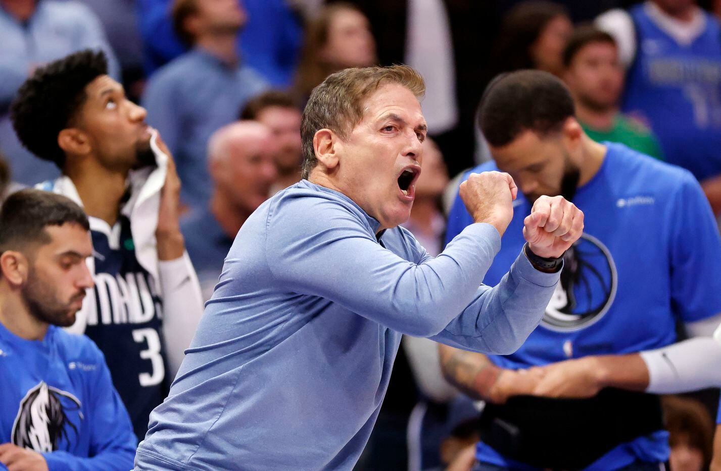 Dallas Mavericks owner Mark Cuban tries to get the referee’s attention after they didn’t...