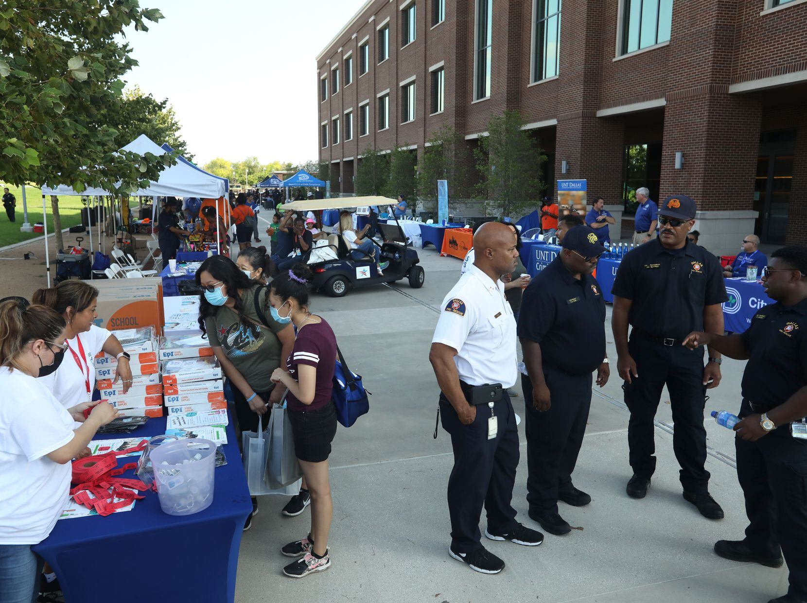 Community members visi vendor booths during the Summer of Safety celebration at the UNT...