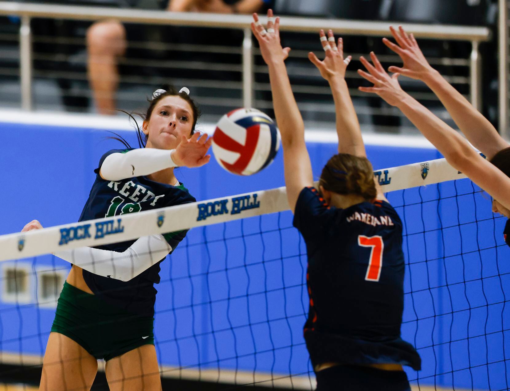 Frisco Reedy’s Halle Schroder (18) hits the ball over the net past Frisco Wakeland’s Jessica...