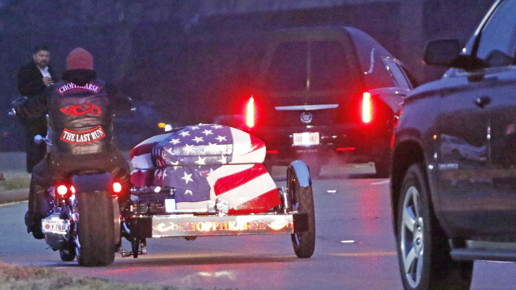 A motorcycle carrying Richardson police officer David Sherrard leads funeral procession at Watermark Community Church in Dallas, Texas, Tuesday, February 13, 2018. 