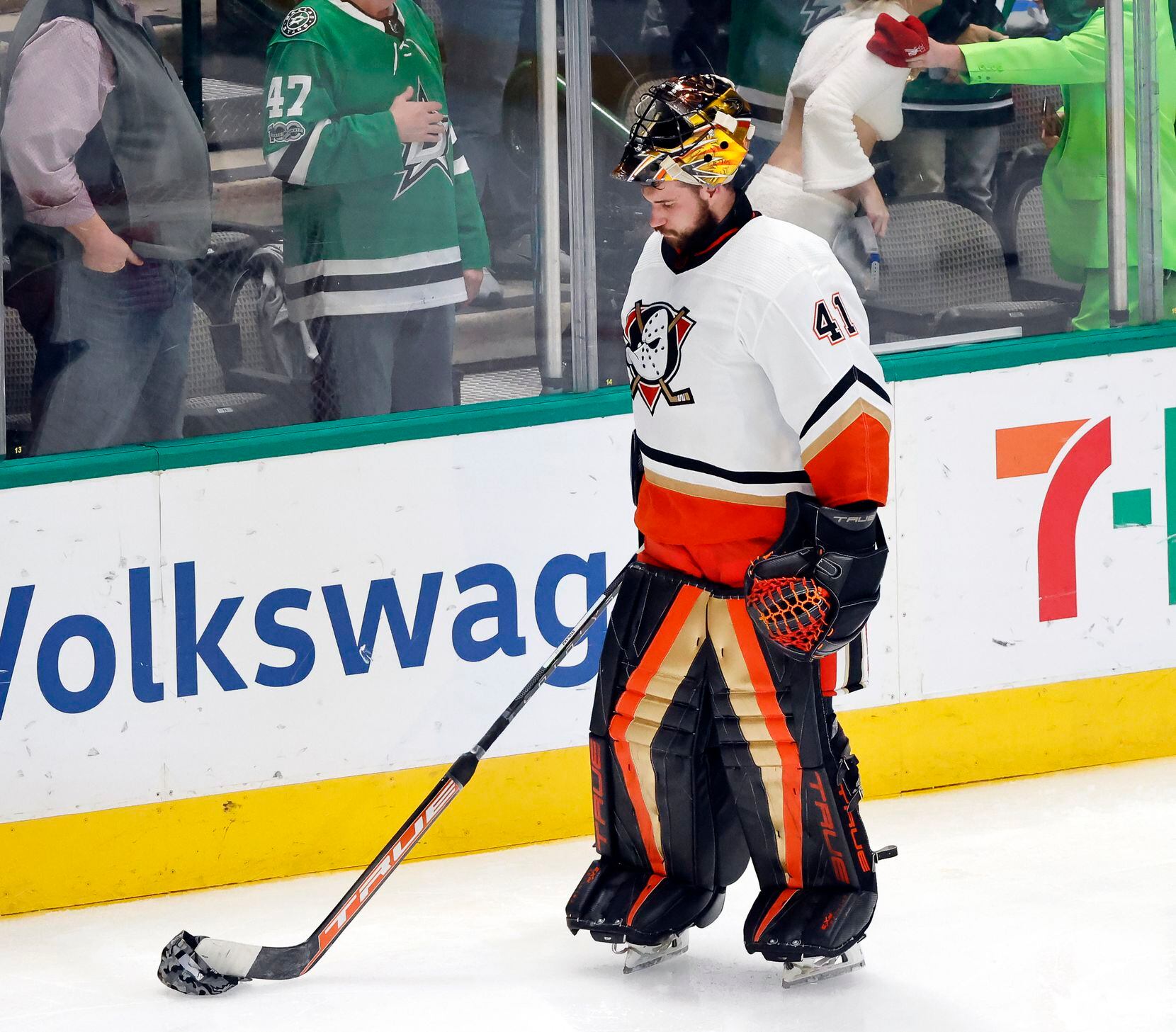 Anaheim Ducks goaltender Anthony Stolarz (41) pushes a hat across the ice after giving up a...