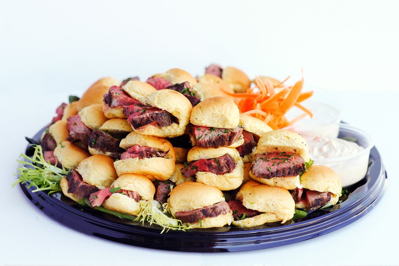 TJ's Seafood Market's catering menu includes platters of beef tenderloin sliders.