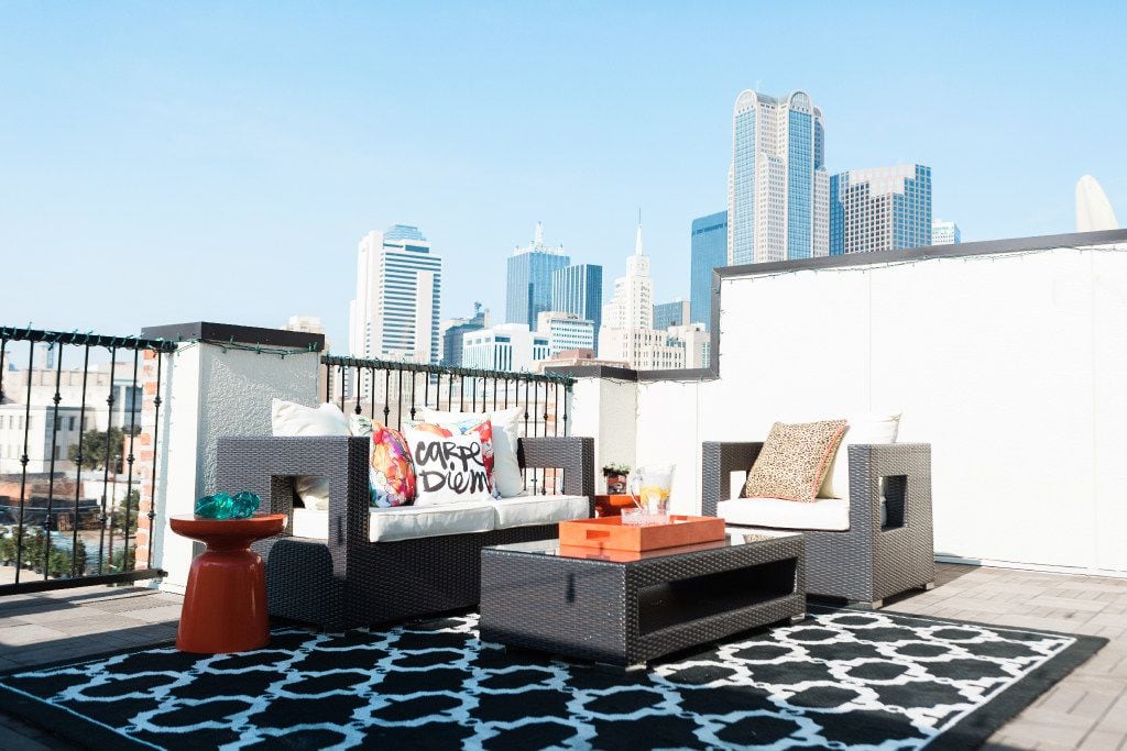 Personalize your outdoor space with pillows, rugs and umbrellas, suggests Dallas designer...