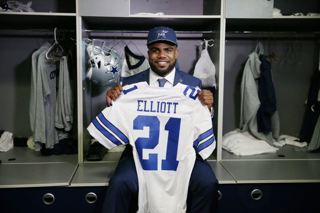 Running back Ezekiel Elliott, who played for Ohio State, sits for a photograph in his locker after he was introduced by the Dallas Cowboys after being drafted fourth overall in the 2016 NFL draft by the Cowboys at the team's headquarters in Irving, Texas, Friday April 29, 2016. (Andy Jacobsohn/The Dallas Morning News)