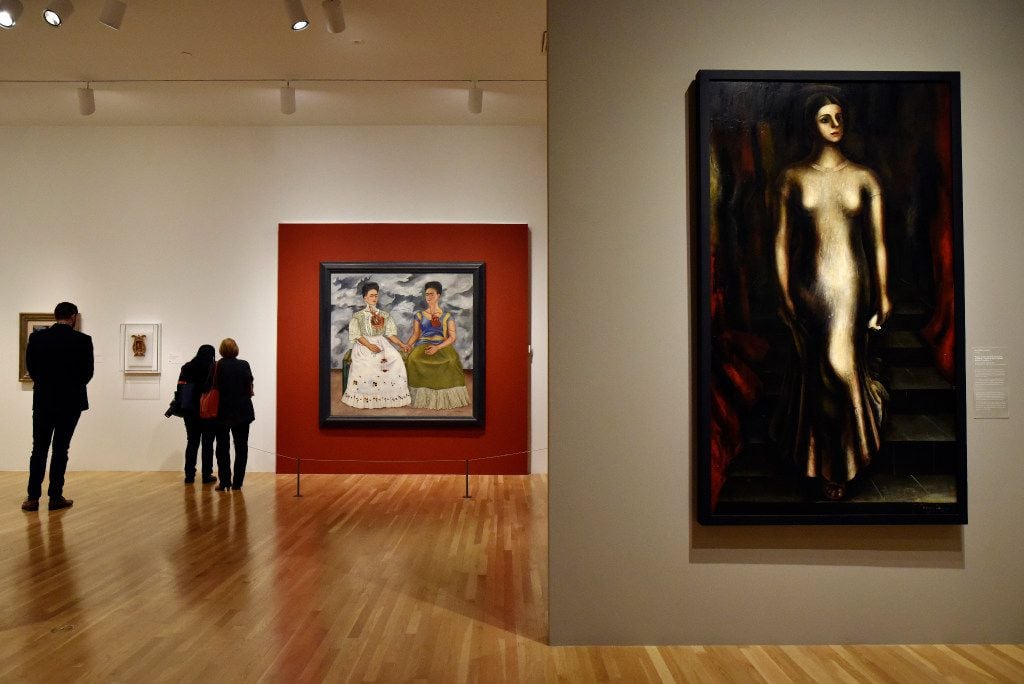 The Two Fridas 1939, oil on canvas, left, and a portrait of Maria Asunsolo Descending a...