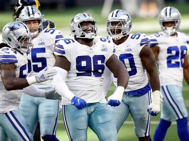Cowboys defensive tackle Neville Gallimore (96) celebrates his stop of Steelers running back Benny Snell during the first quarter of a game at AT&T Stadium in Arlington on Sunday, Nov. 8, 2020.