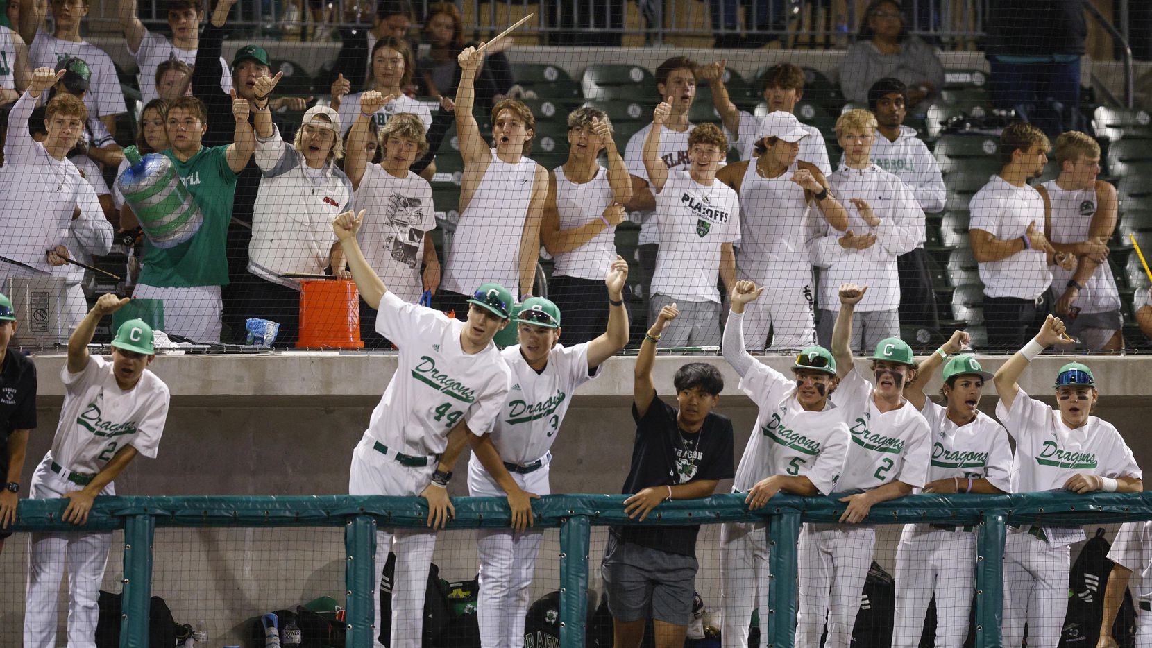 Southlake Carroll players and fans celebrate a strikeout by starting pitcher Griffin Herring...