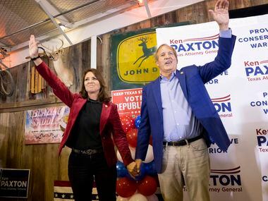 Sen. Angela Paxton and husband Attorney General Ken Paxton wave to the crowd during a Collin...
