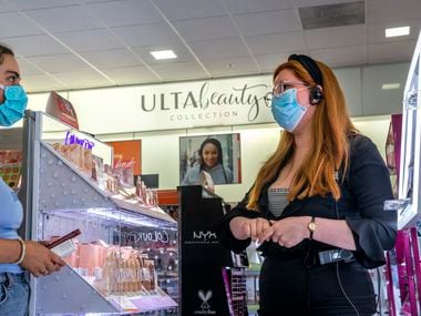 Co-manager Samantha Corral (right) helps Alex Coulson pick out makeup products at Ulta Beauty.