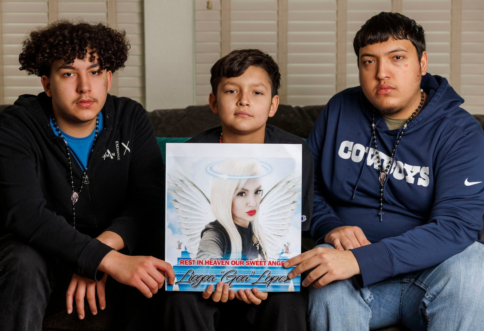 Favian Hernandez, 16 (left), David Cantu, 11 (center), and Francisco Hernandez, 21, held on...