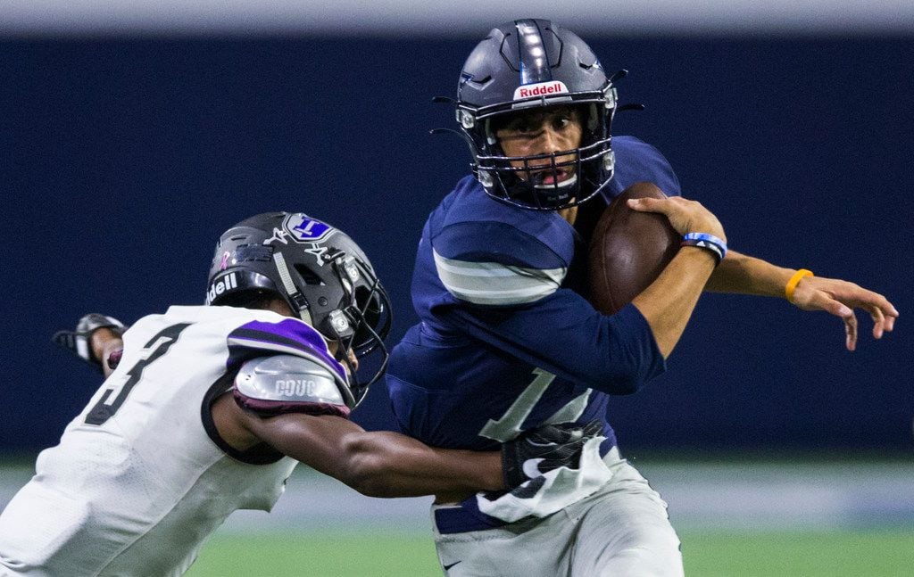 Frisco Lone Star quarterback Dylan Deleon (14) is tackled by Frisco Independence linebacker...