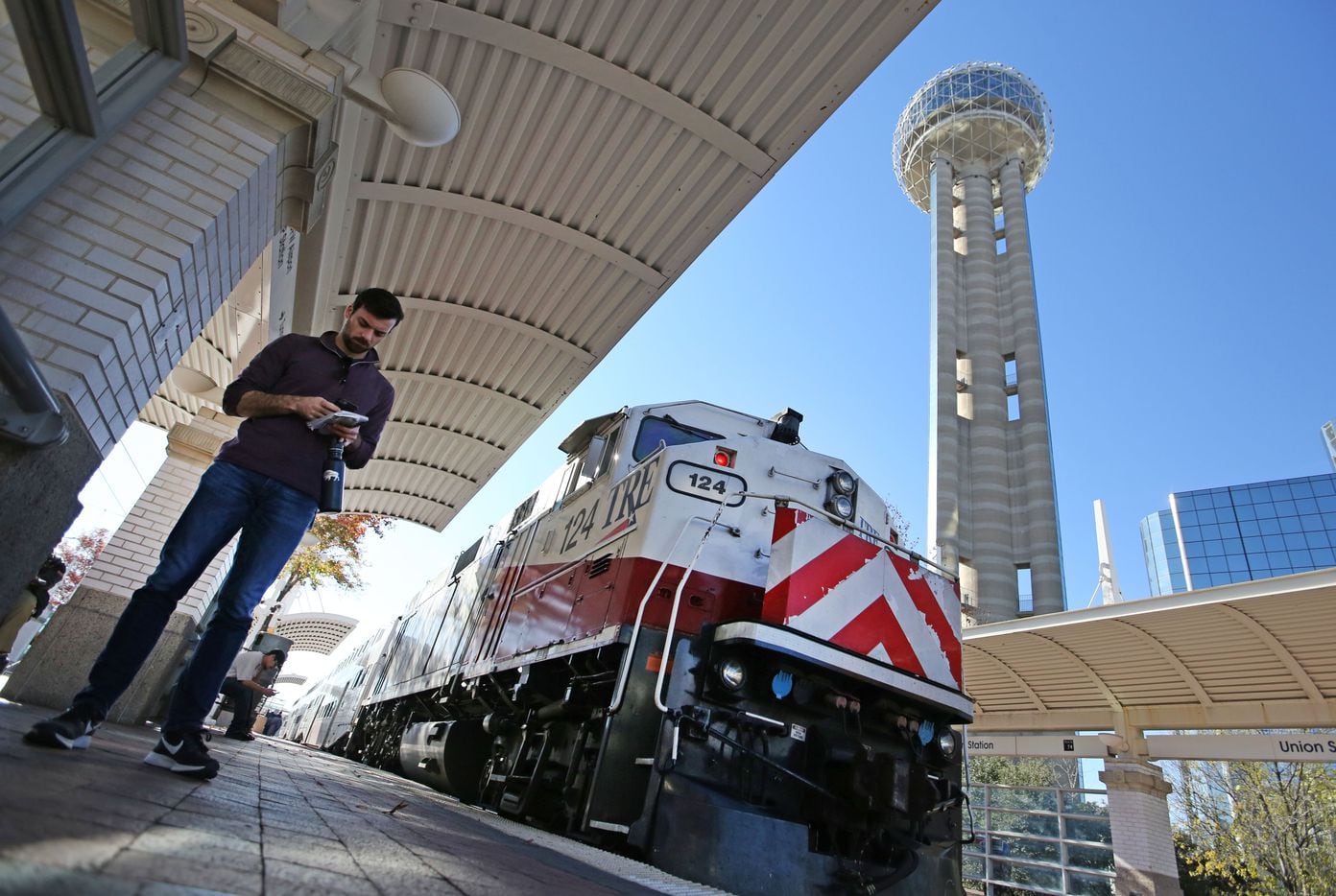 Dallas Morning News reporter Brendan Meyer waits to board the TRE train at Union Station as...