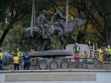 The Robert E. Lee statue is put in the back of a trailer truck at on Sept. 14, 2017.