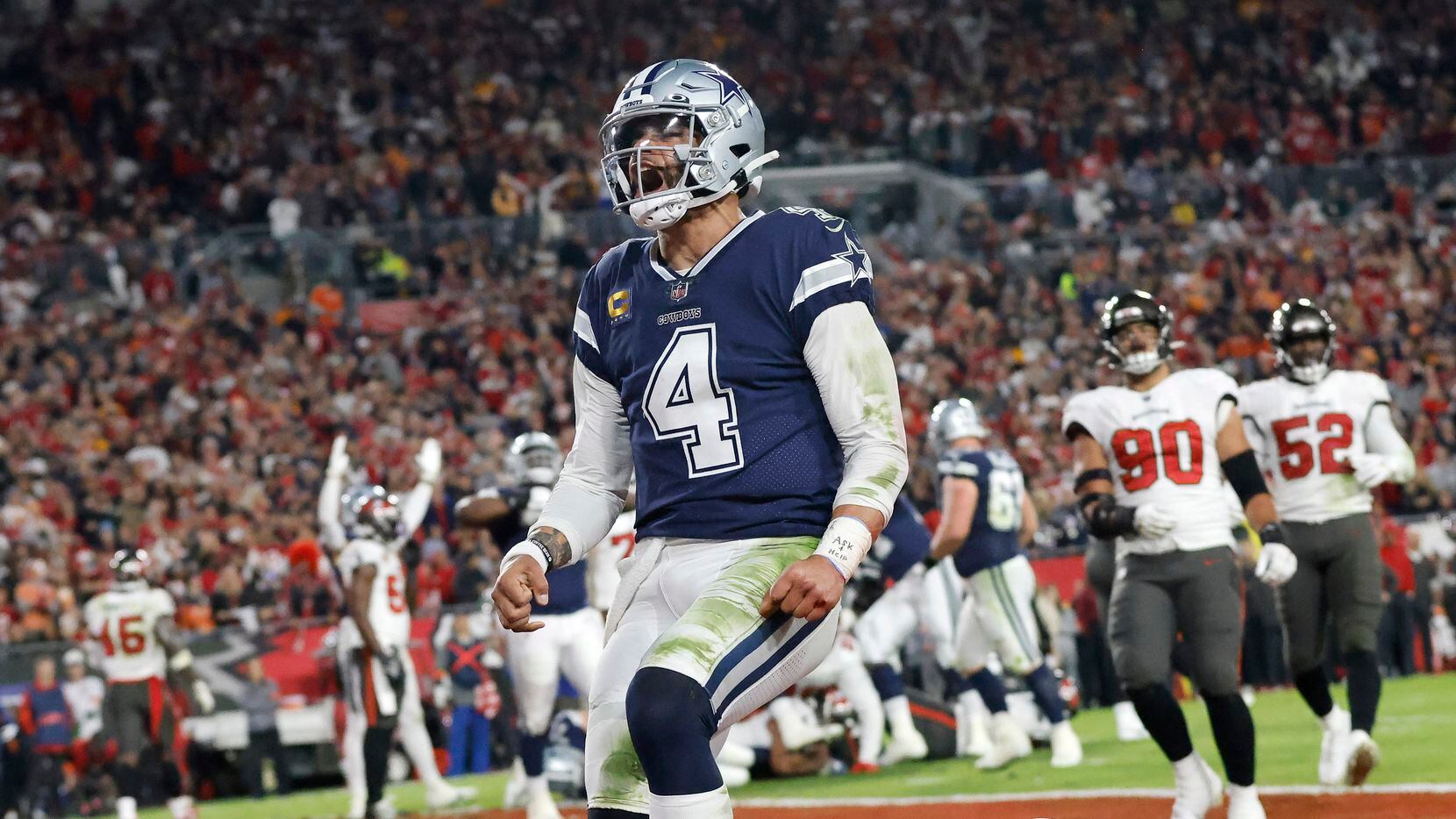 Dallas Cowboys quarterback Dak Prescott (4) celebrates his second quarter touchdown run...