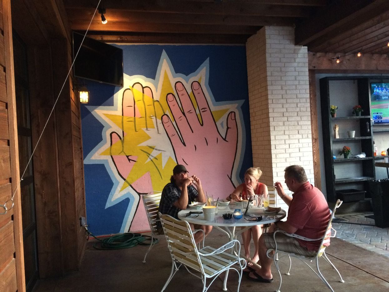 High Fives are abundant at this new spot on Henderson. The bar and restaurant has an...